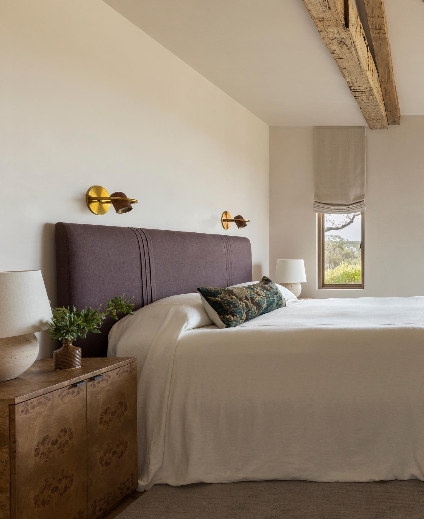 Serene and freshly sophisticated bedroom with reading sconces above headboard - Marie Flanigan Interiors.