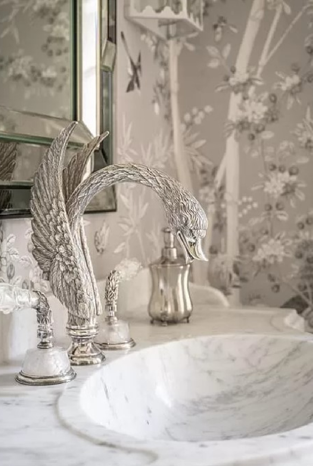 Detail of swan faucet in a grey bath in a French inspired chateau in Houston.