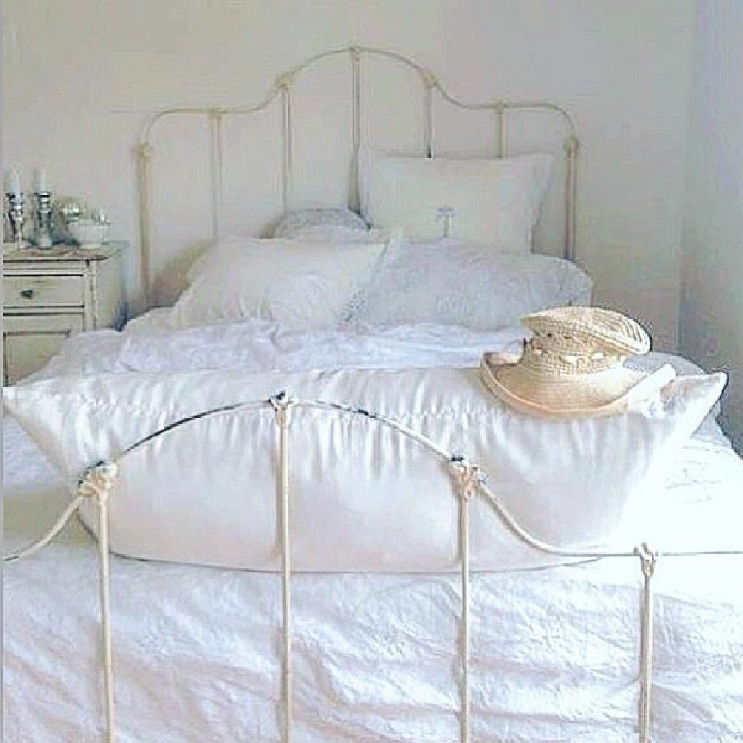 Sumptuous white bedding in French Nordic bedroom with Swedish antiques - My Petite Maison. #frenchnordic #romanticbedrooms