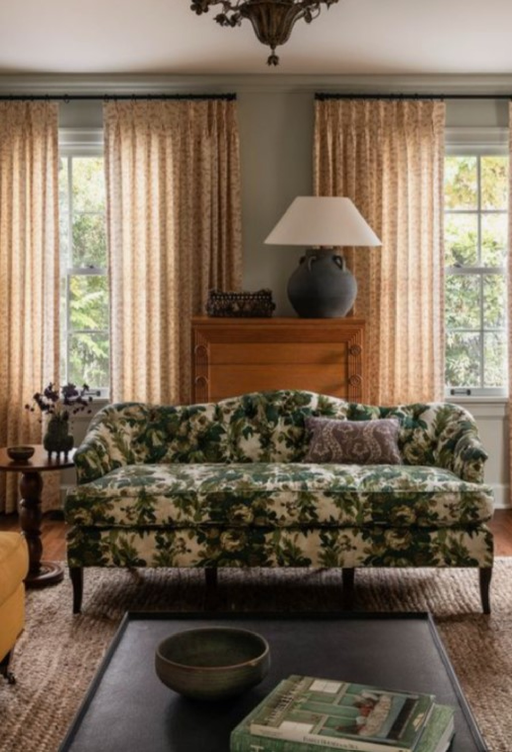 Heidi Caillier designed East Newton living room with cozy warm green sofa. #europeancountrycottage #vintagemodern #traditionallivingroom