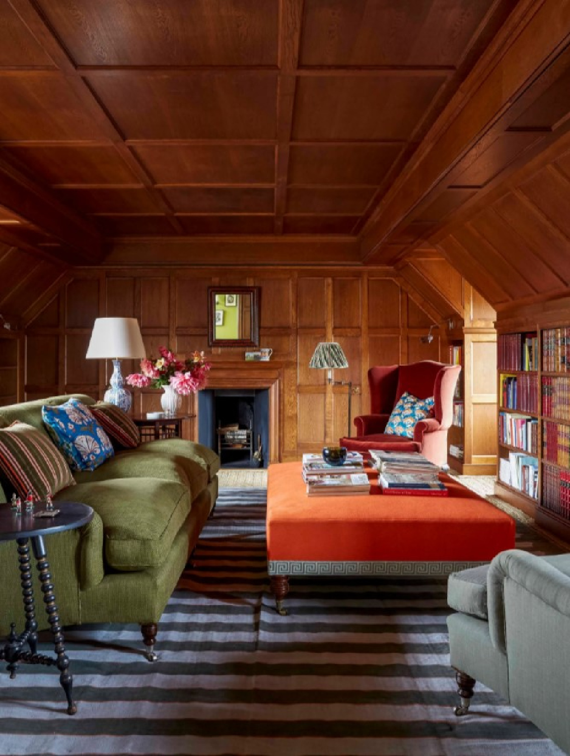 Green sofa and orange ottoman in Ben Pentreath designed arts and crafts cozy snug with builtins and paneling (photo Paul Massey in House & Garden UK). #britishstyle