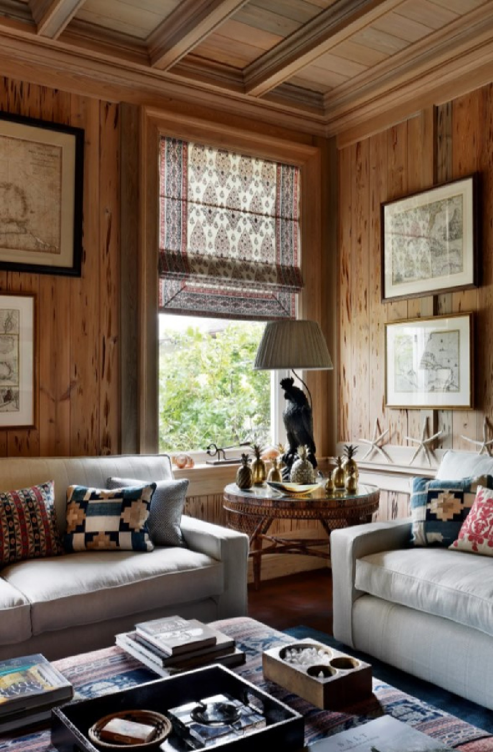 A John McCall designed cozy snug with pecky cypress paneling (photo Alexander James for House & Garden UK).