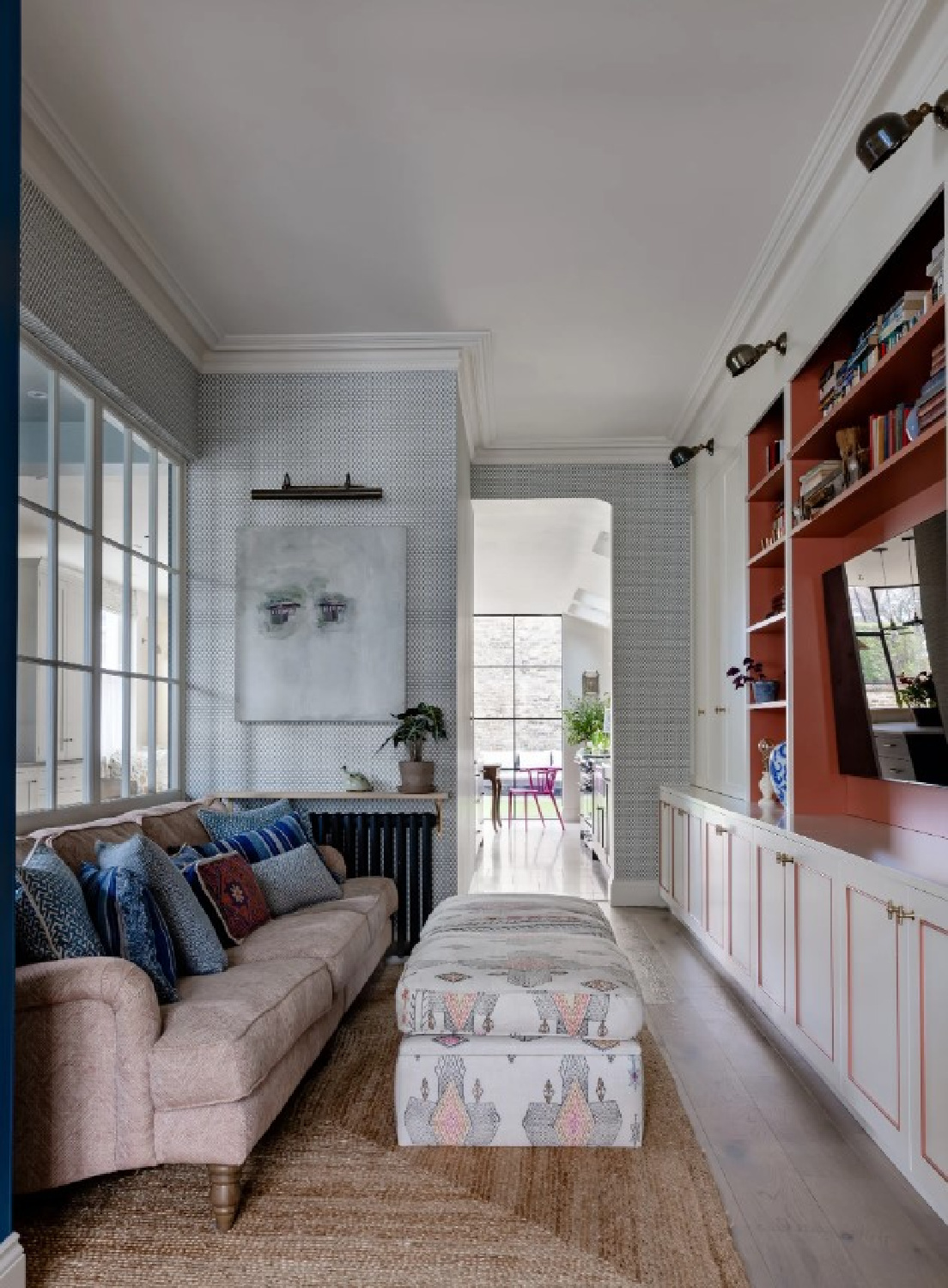 Polly Ashman designed snug room (photo Owen Gale for House & Garden UK) with built-ins and TV is a cozy media space.