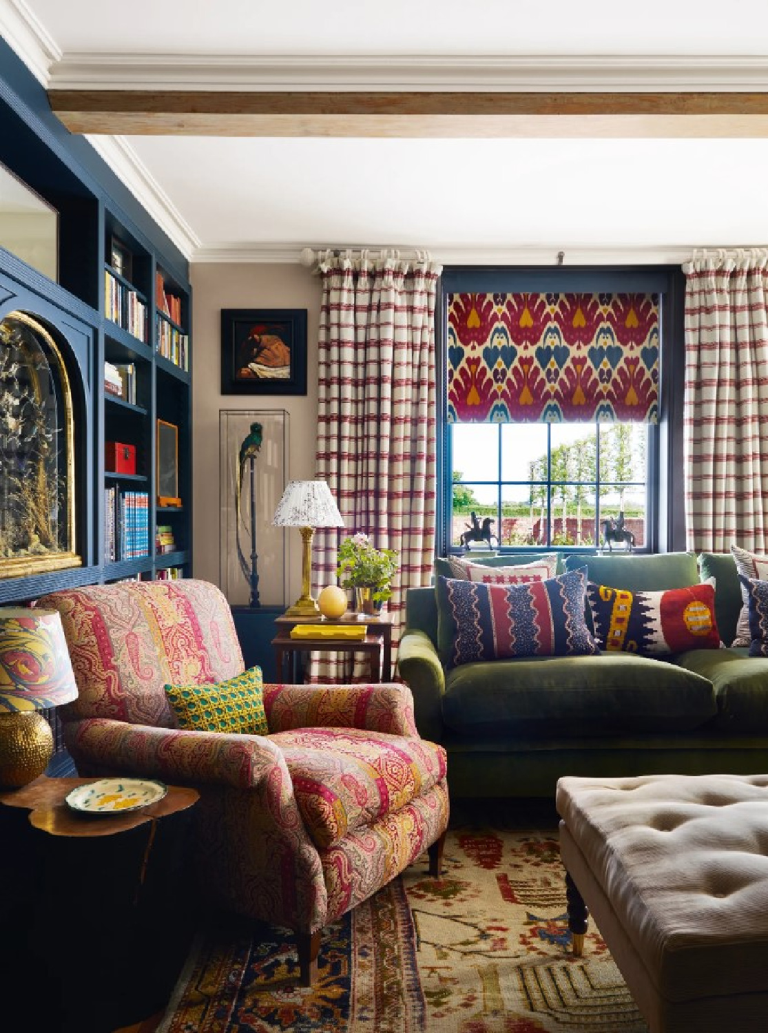 Rita Konig designed snug has a lively mix of patterns and unexpected colors (photo Paul Massey for House & Garden UK). #englishcountrystyle #britishinteriors