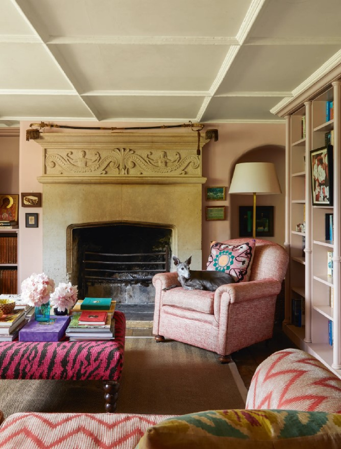 Mauve walls and beautiful stone fireplace in the cozy English country Hiscox residence in House & Garden UK. #pinkrooms #englishcountry