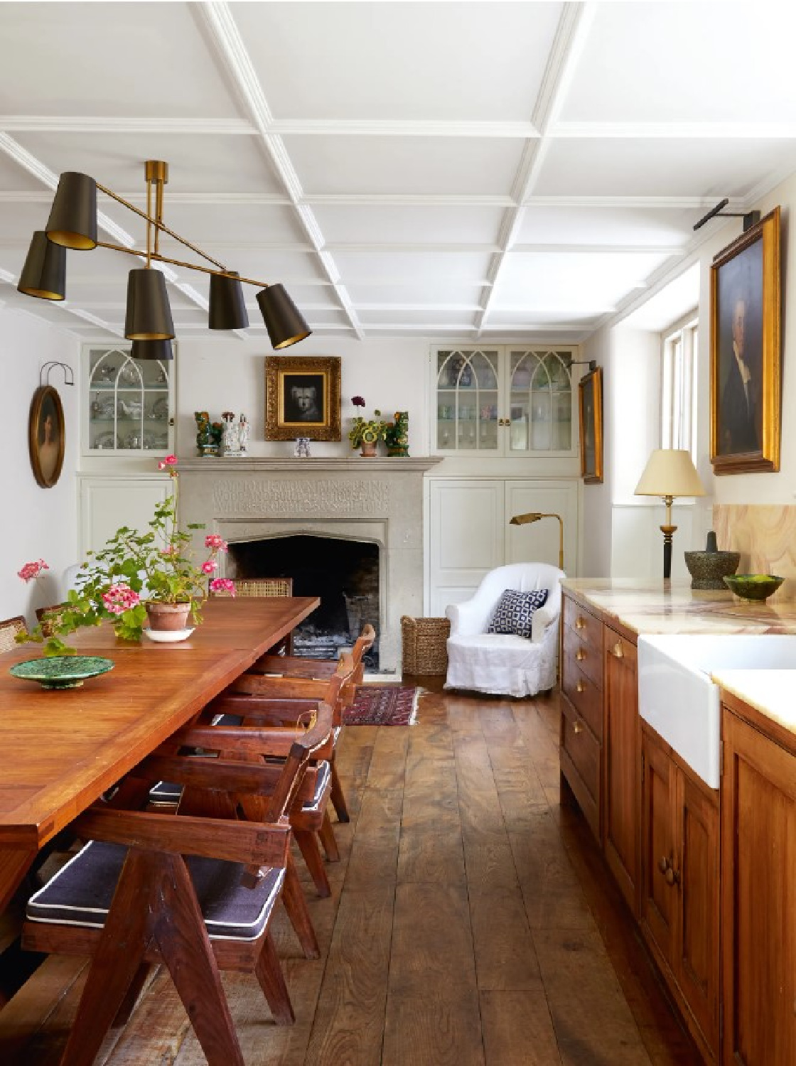 Snug room with fireplace at Cotswold home of Renshaw and Sarah Hiscox in HouseandGardenUK (photo Paul Massey). #cotswoldcottage #englishcountrystyle