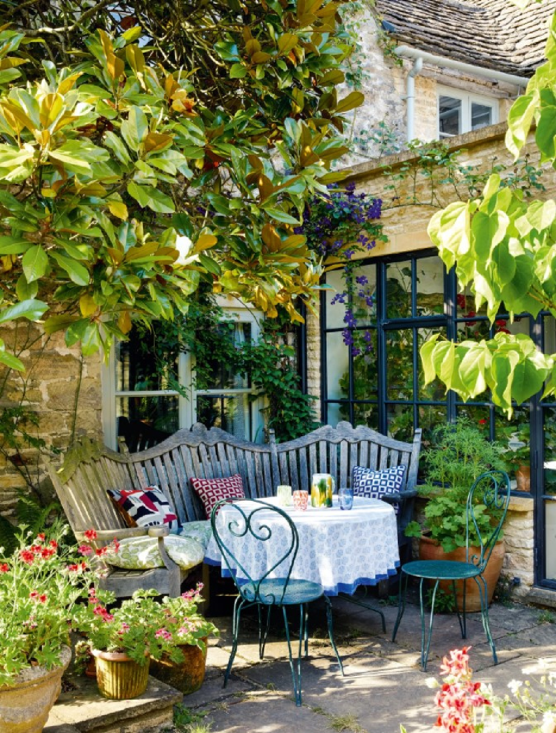 Beautiful garden at Cotswold home of Renshaw and Sarah Hiscox in HouseandGardenUK (photo Paul Massey). #cotswoldcottage #englishcountrystyle
