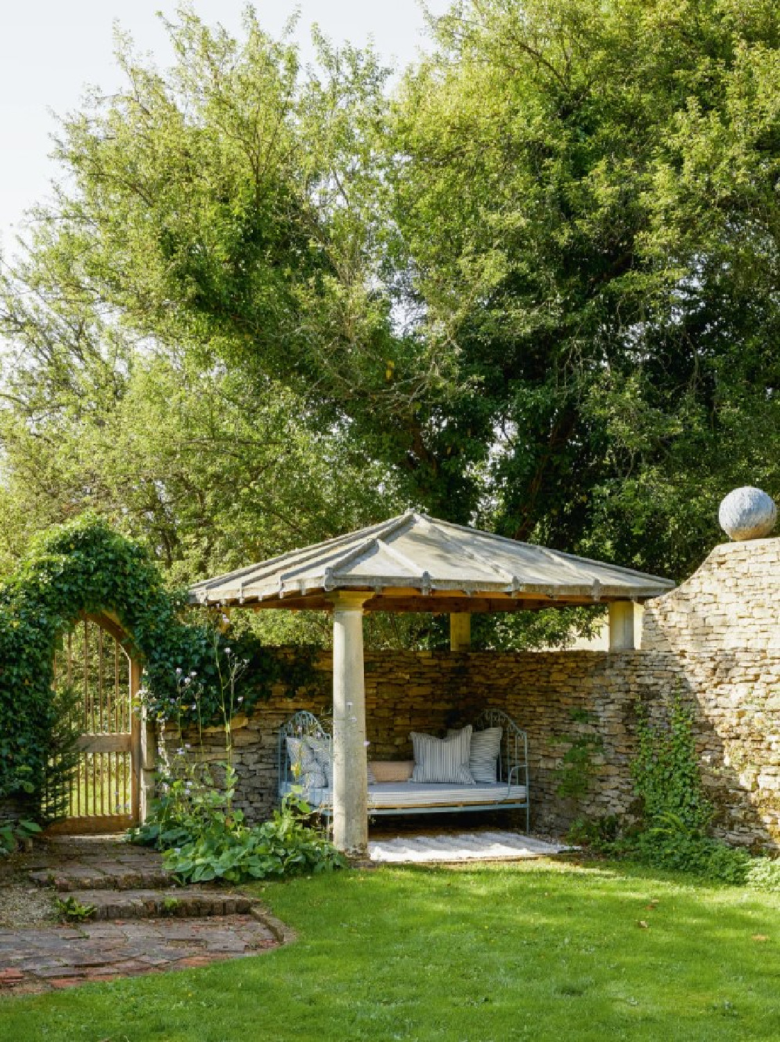 Beautiful garden at Cotswold home of Renshaw and Sarah Hiscox in HouseandGardenUK (photo Paul Massey). #cotswoldcottage #englishcountrystyle