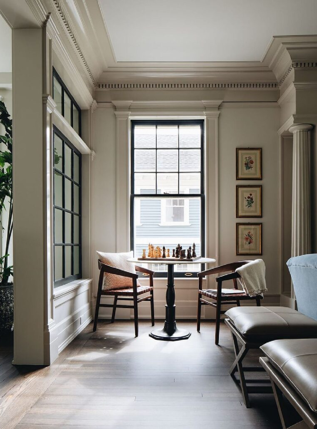 Jean Stoffer Design - a warm and cozy sitting area for chess near a window. #englishcountry #traditionalstyle