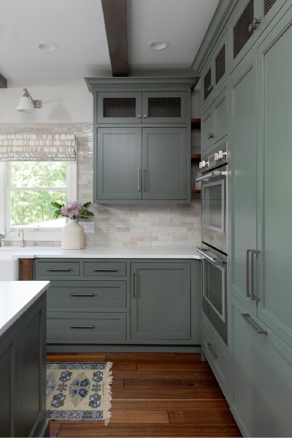 Sherwin Williams Rosemary painted cabinets in kitchen - @kristiekoningdesign. #sherwinwilliamsrosemary #greenkitchen