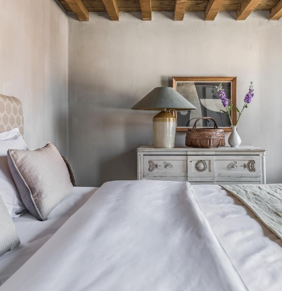 Odavaere - Belgian style interior design in a beautifully serene bedroom with soothing grey textures and rustic elegance. #europeancountry