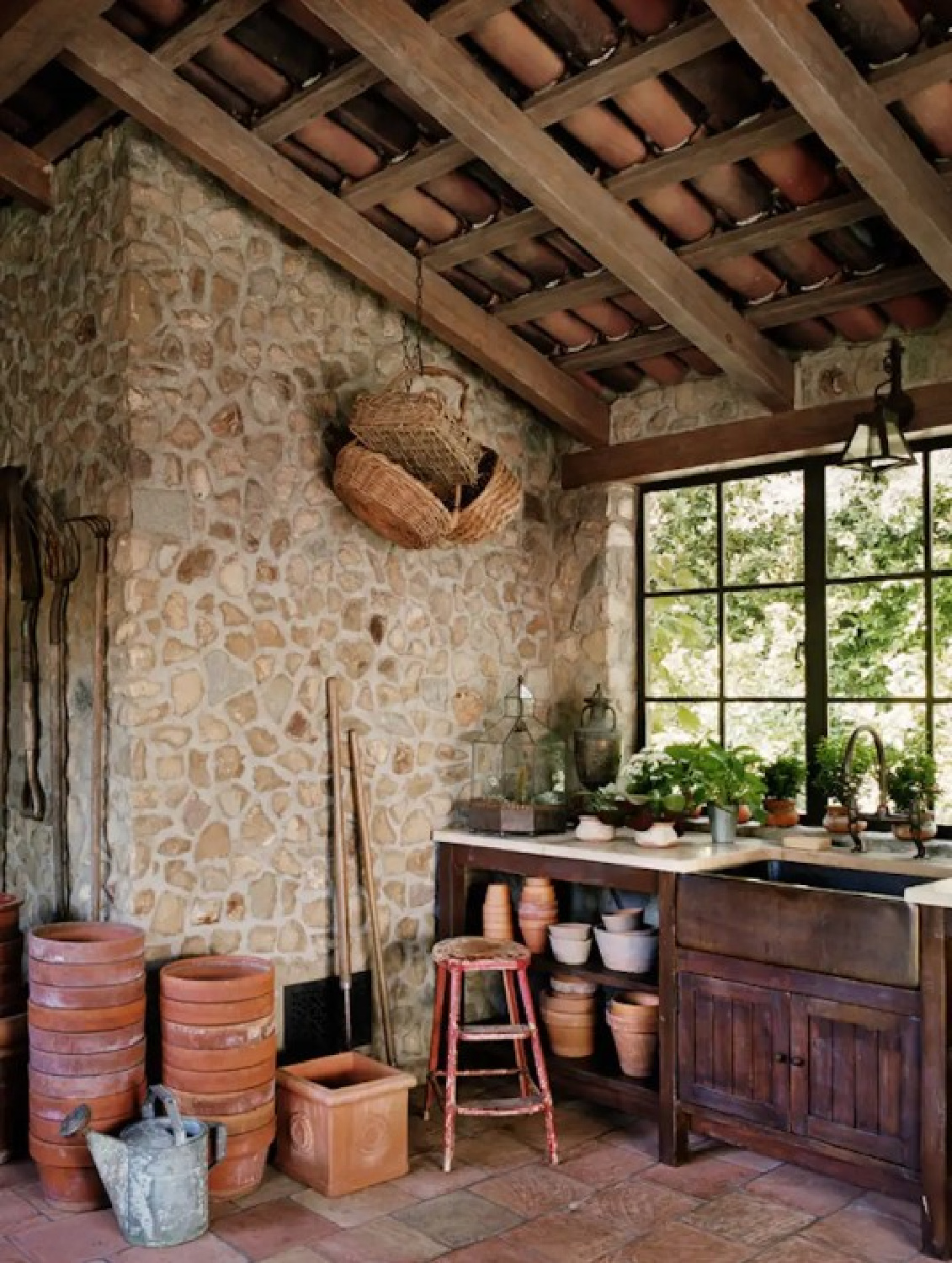 Thomas Calloway Spanish Colonial rustic potting room with stone and rustic wood. #europeancountry #rusticinteriors #sophisticatedinteriors