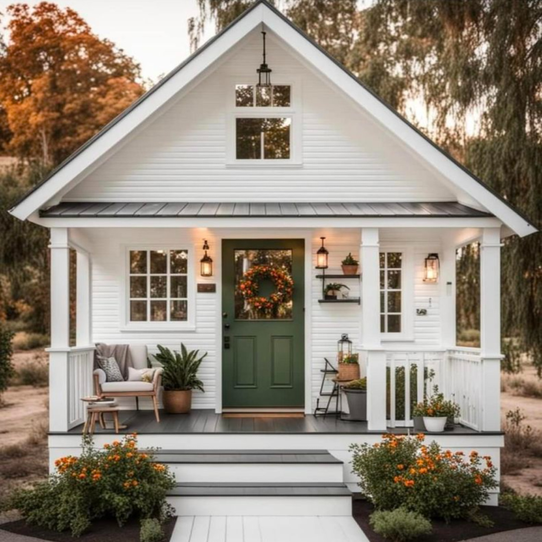 Sweet small white cottage with green front door and holiday decor. AI Design via Whitney Hess (Just Decorate!). #aidesign #aiinteriordesign #aiarchitecture