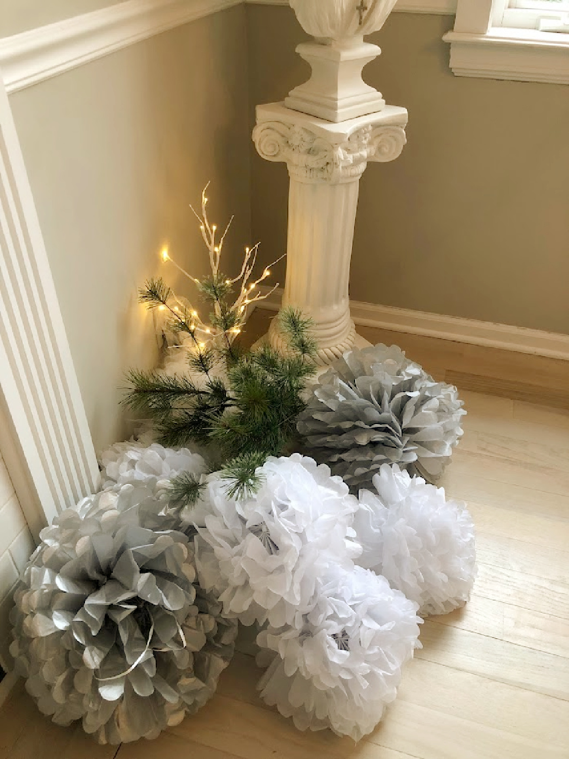 Hello Lovely's serene white holiday decorations in the dining room. #hellolovelyhome