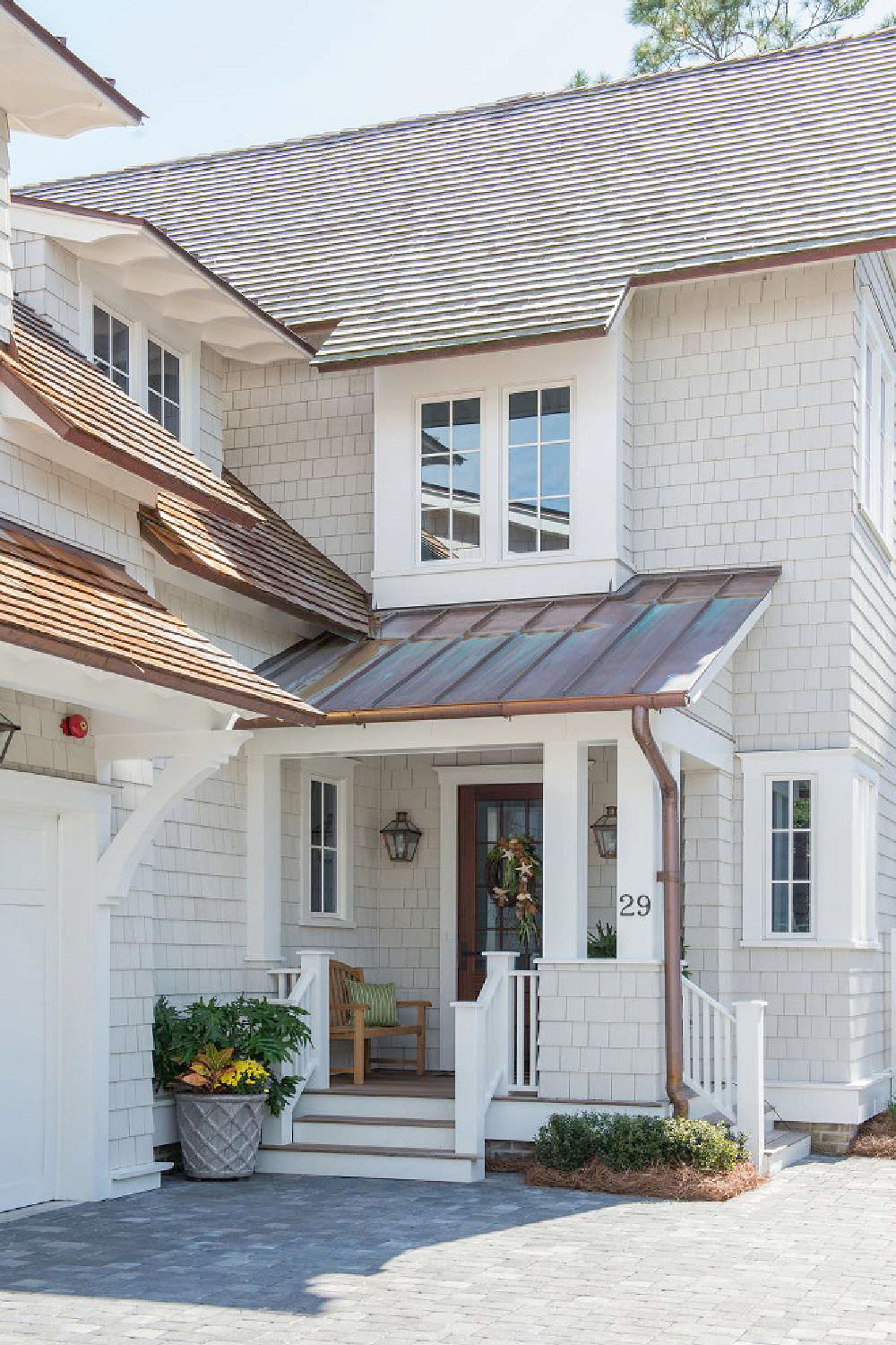 Repose Gray (Sherwin-Williams) on cedar shake siding of a beautiful home via Life on Summer Hill. #sherwinwilliamsreposegray #graypaintcolors #housepaintcolors #reposegray