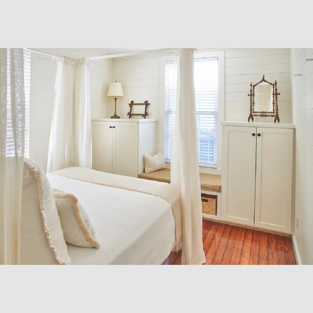 Built-in storage in a tiny southern cottage bedroom with wood floors and window seat - Southern Living.