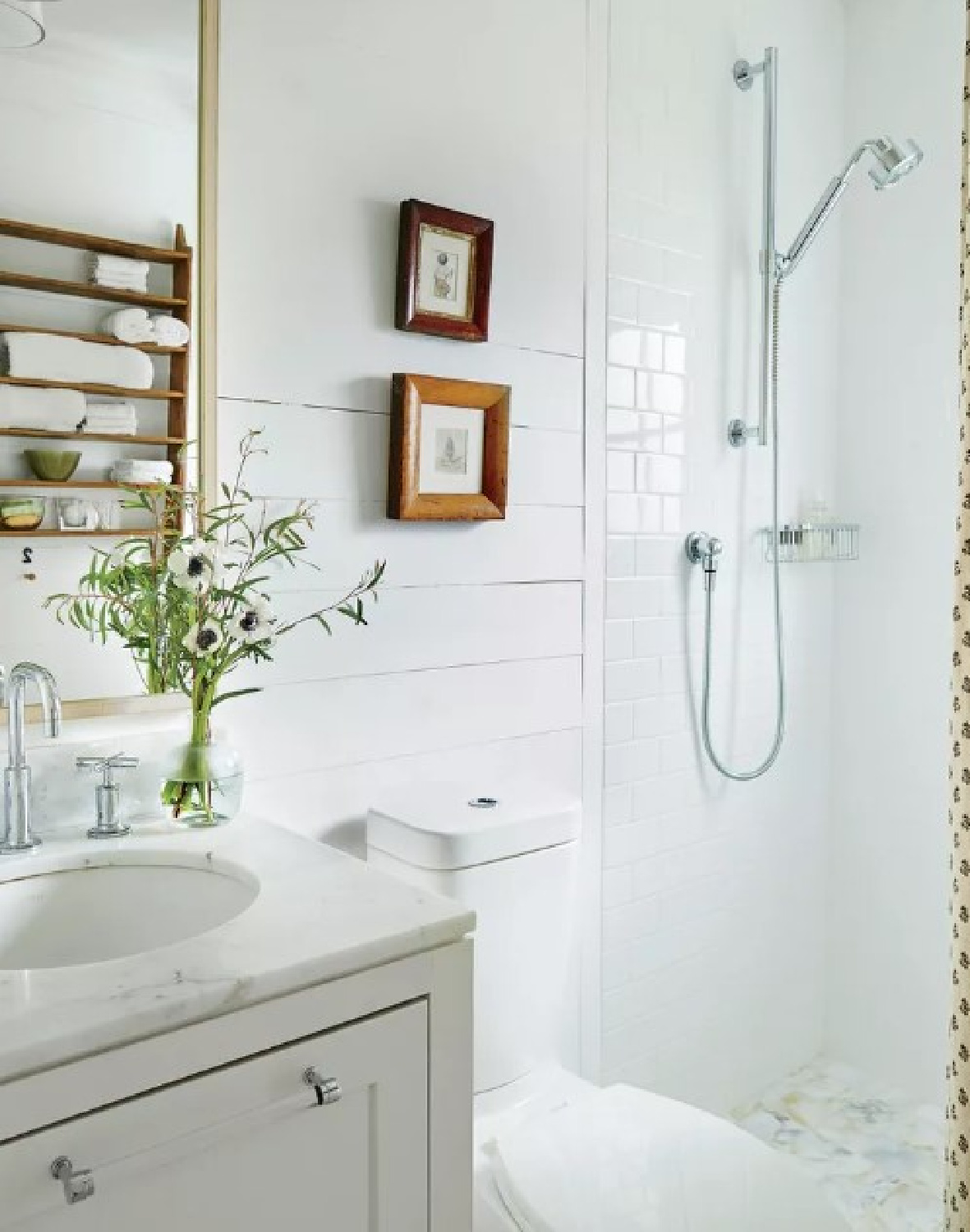 Detail of a little renovated white bath in a 1889 southern cottage in Southern Living.
