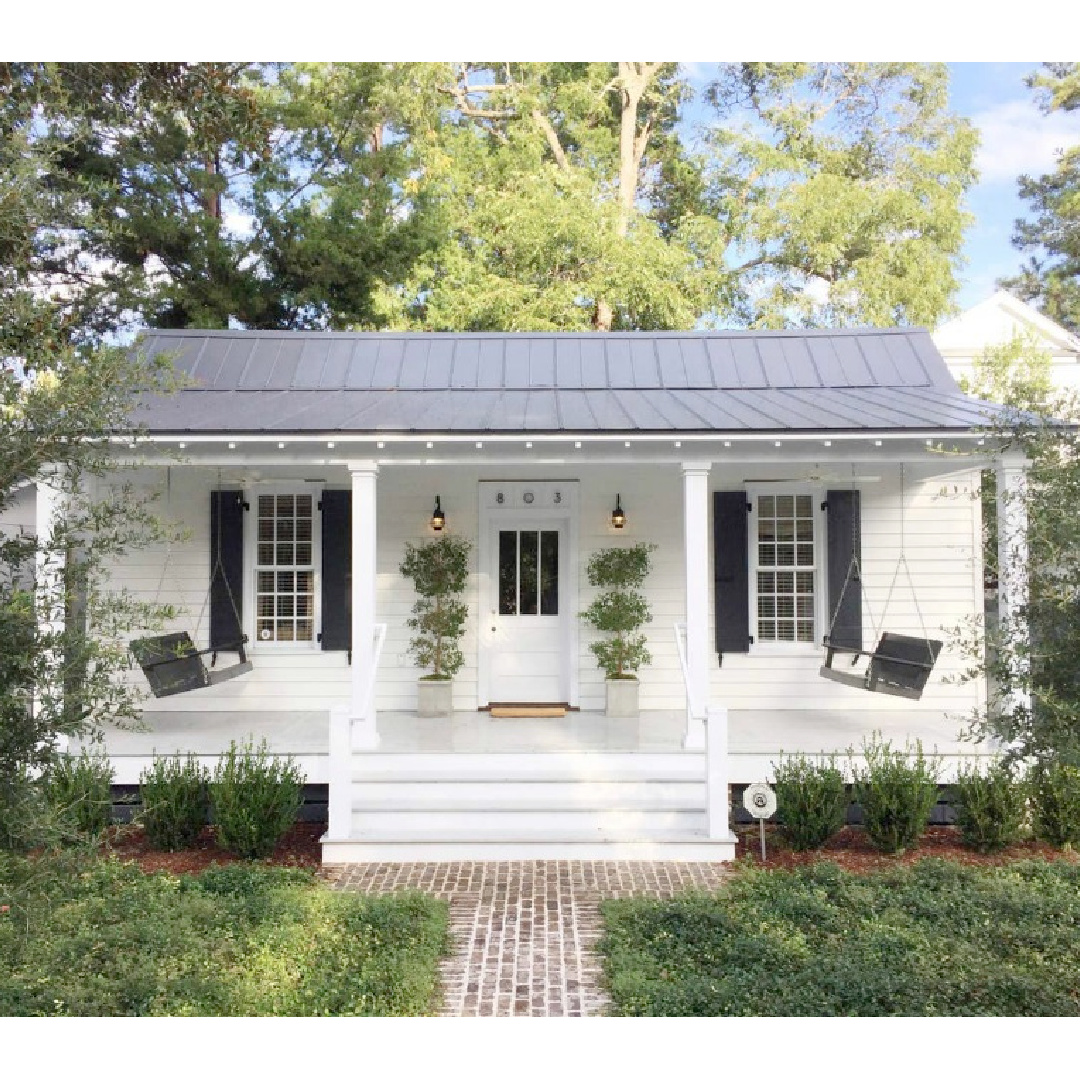 660 sf renovated 1889 lowcountry cottage with charming front porch and white interiors in Beaufort, SC - Southern Living. #lowcountrycottage #smallhouseliving #southerncottage