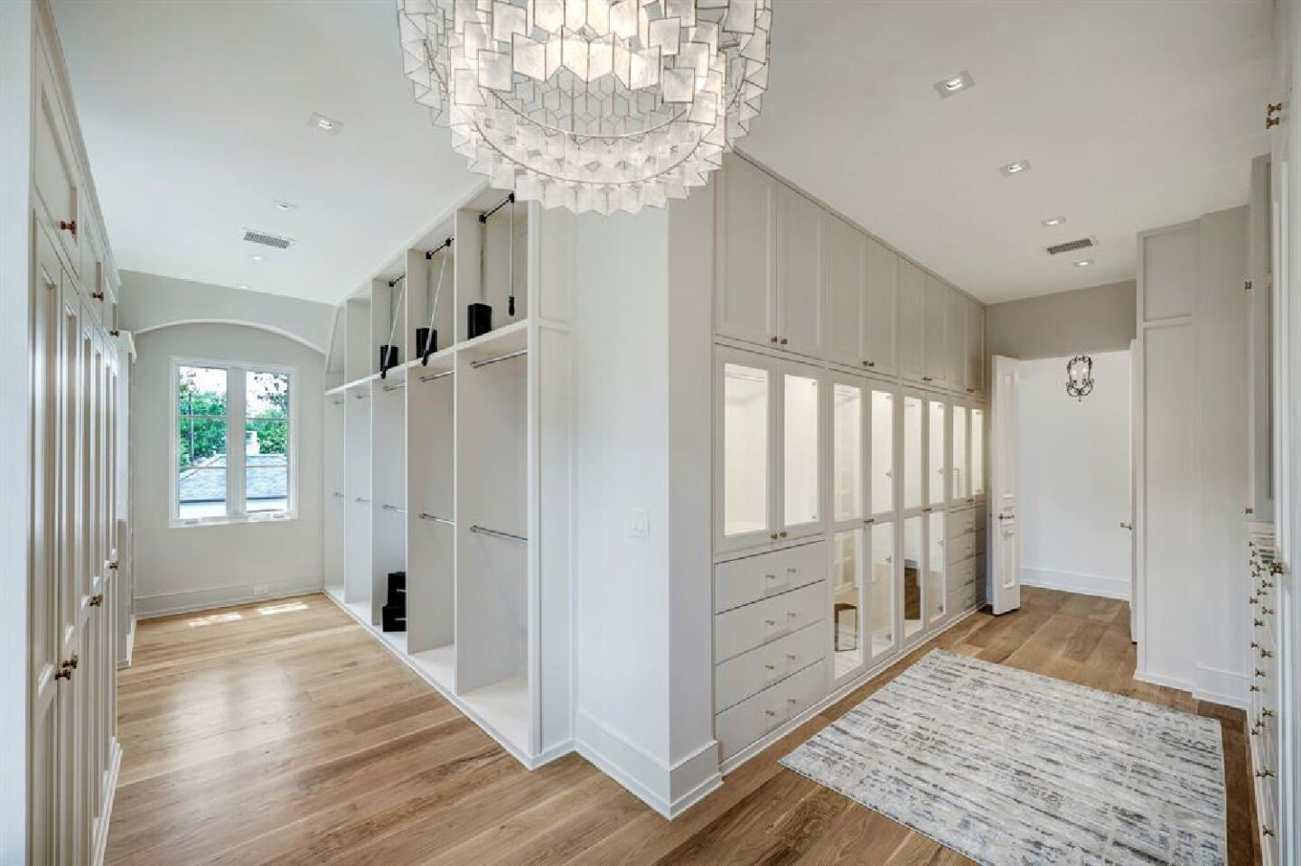 Bespoke closet design in Stone floor in 2445 Pine Valley Ct., Houston - Jennifer Hamelet of Mirador Builders; European style and interiors with reclaimed materials from Chateau Domingue. #europeanmanor #oldworldstyle