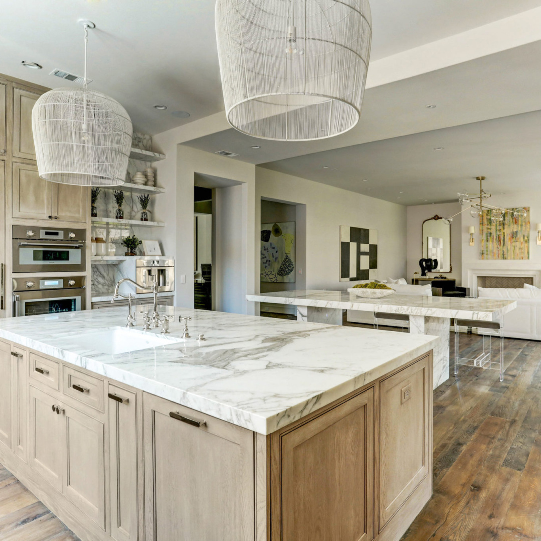 Bespoke kitchen with reclaimed oak flooring at 3637 Meadow Lake, Houston home by Elron with Chateau Domingue finishes, flooring, and paneled library by Segreto Finishes. #oldworldstyle #europeanarchitecture #houstonhomes