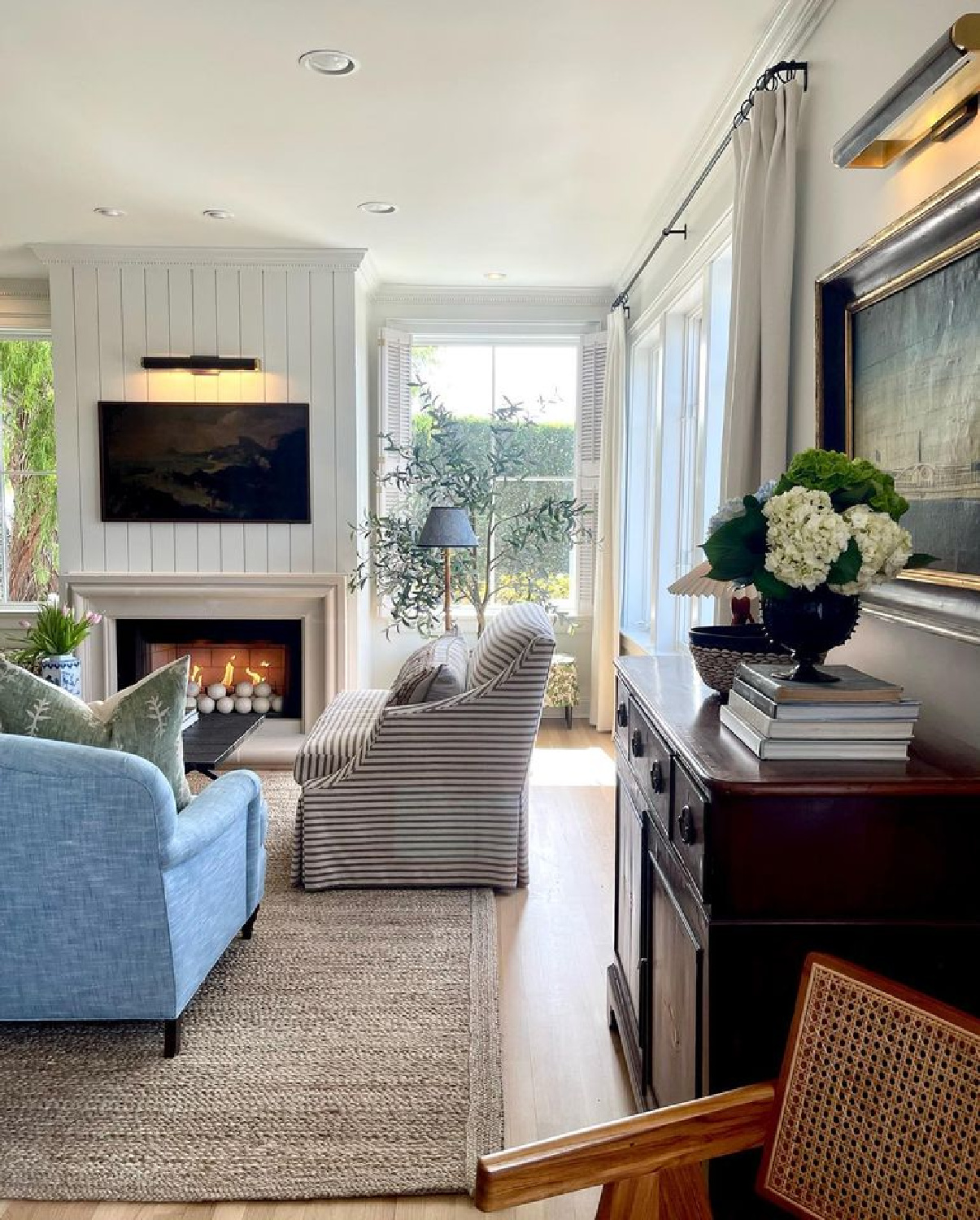 Charming living room in a California beach cottage by @m_m_interior_design.