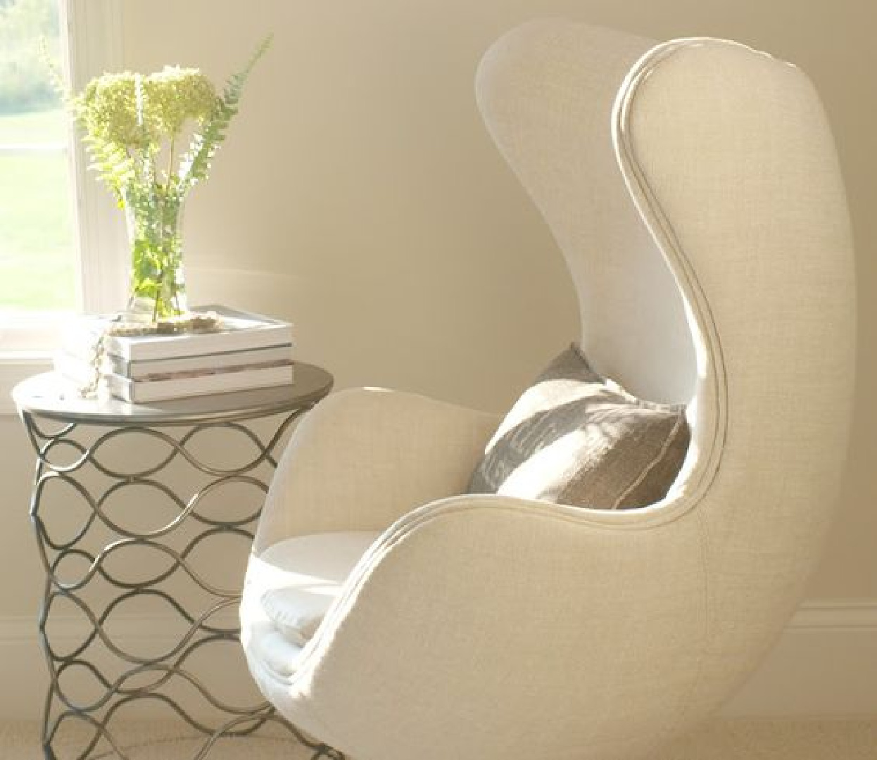 White Sand (Benjamin Moore) in Hello Lovely's living room with Belgian linen egg chair.