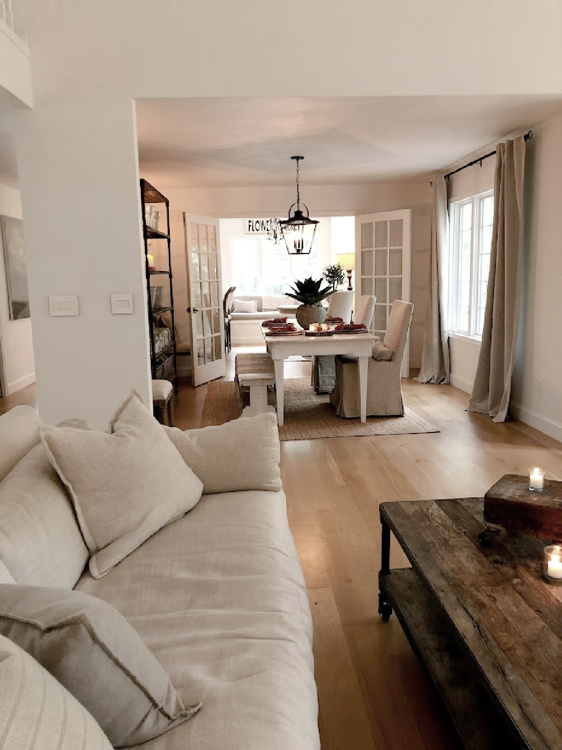 Hello Lovely's modern Belgian living room and dining room with Belgian linen and rustic reclaimed wood. #belgianmodern #belgianminimal #hellolovelyhome