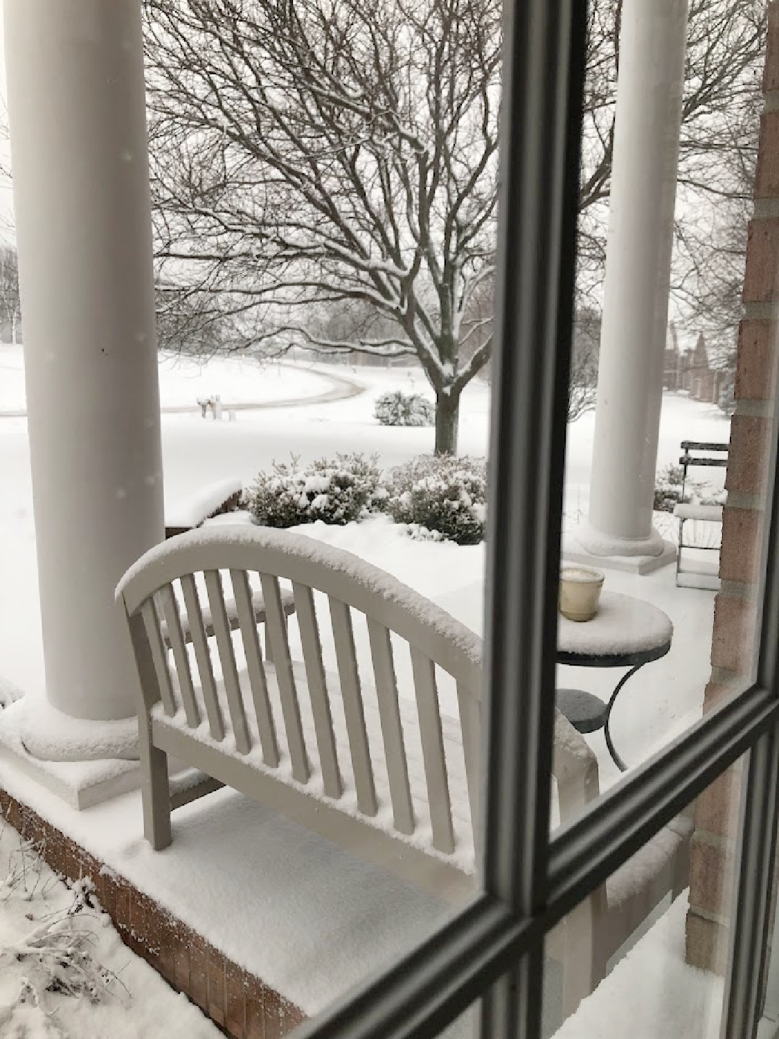 A bench on my front porch in winter snow - Hello Lovely Studio. #hellolovelyhome