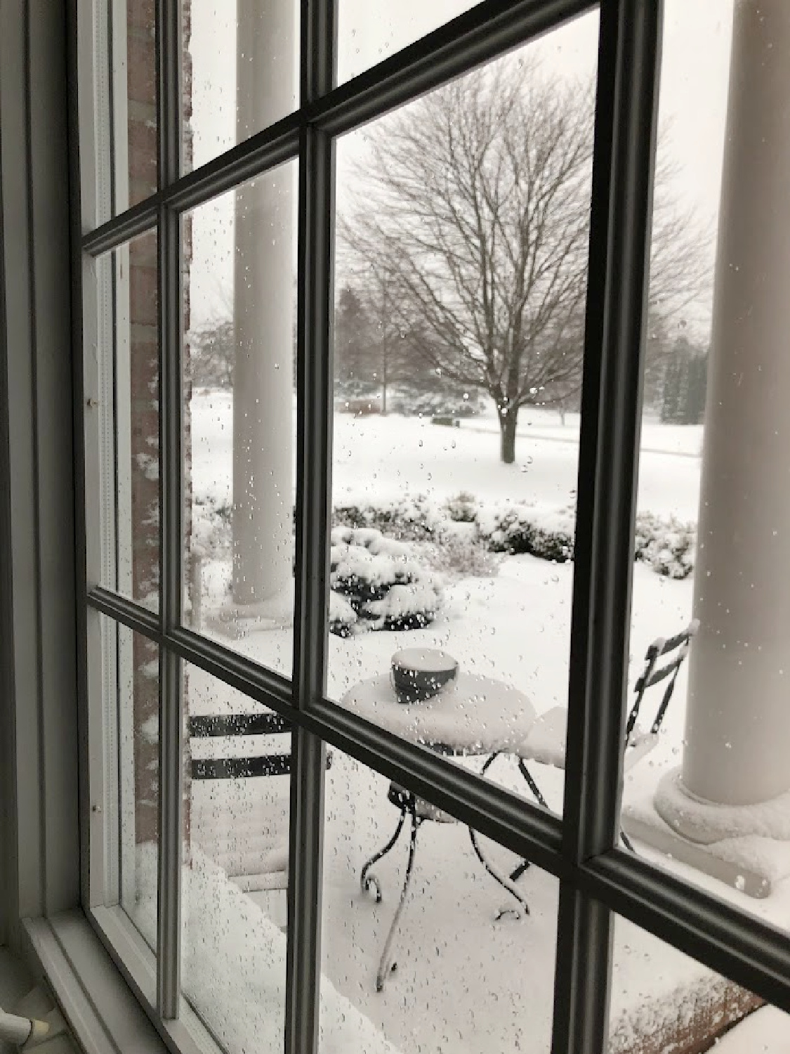 View of my front porch in winter through the living room window - Hello Lovely Studio. #winterporch