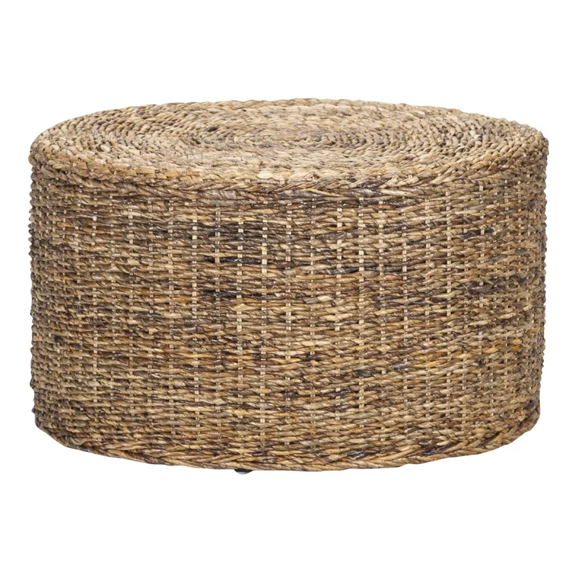 Modern rustic round rattan coffee table adds texture to living rooms, dens, and beyond.