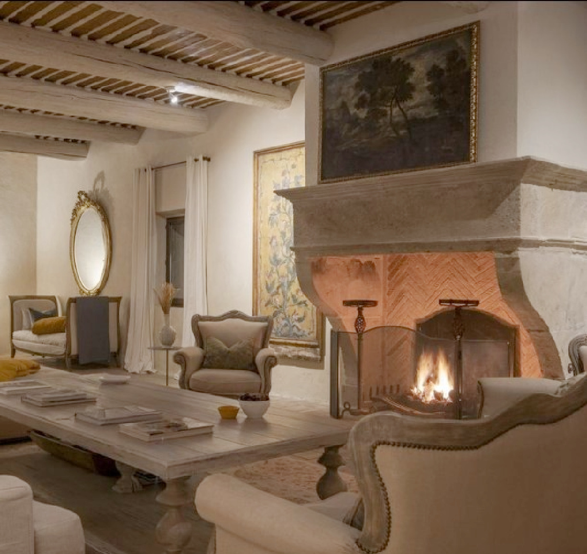 French country parlor with stone fireplace. Warm European luxury and cozy opulence in a French vacation villa in Provence - La Bastide de Laurence. #frenchbastide #frenchvilla #luxuryvilla #provencevilla #warmeuropeanluxury #cozyopulence #provencehomes #frenchcountryinterior