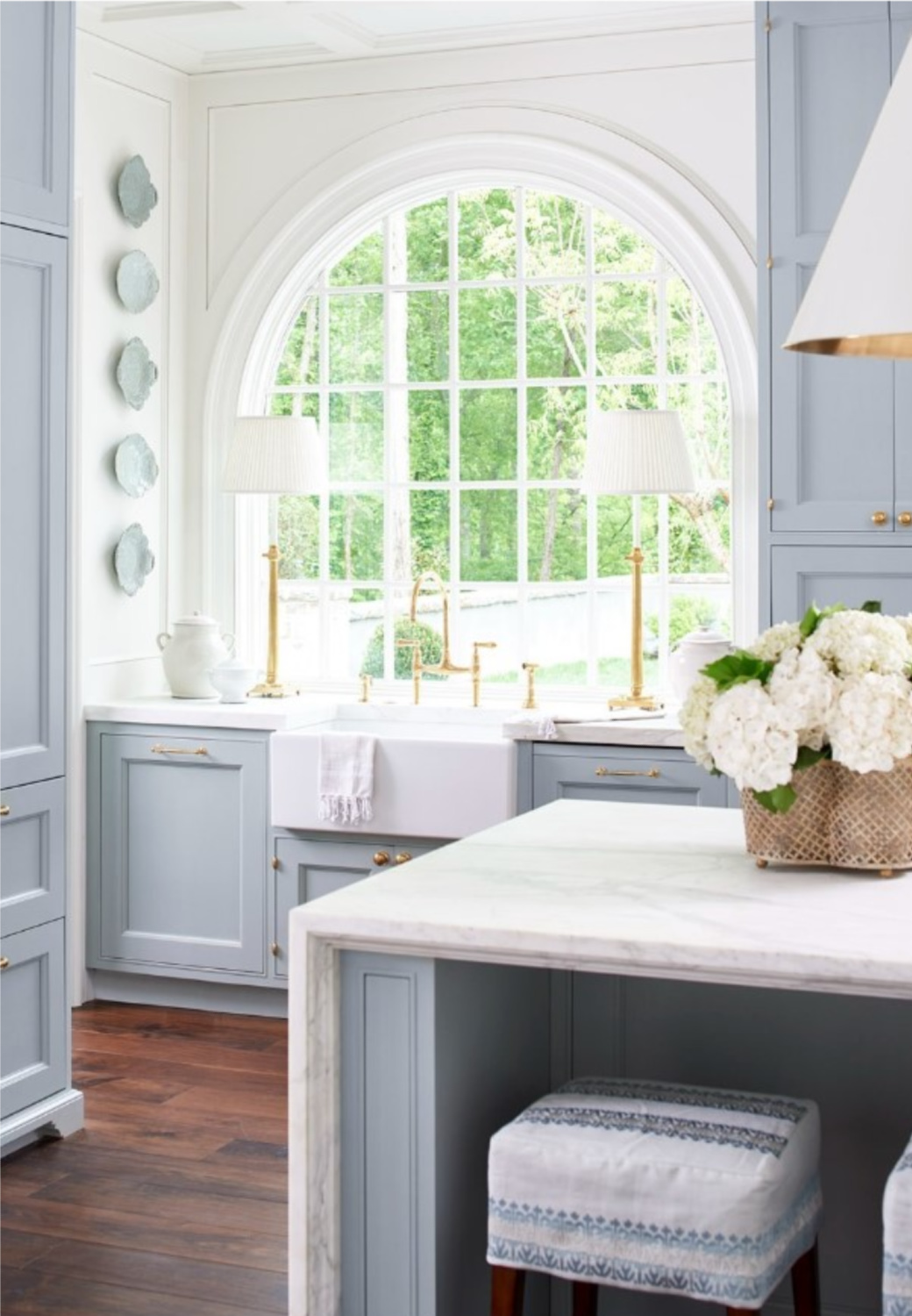 Farrow & Ball Light Blue kitchen cabinets in a traditional style kitchen by @laurendeloachinteriors. #farrowandballlightblue #bluekitchencabinets