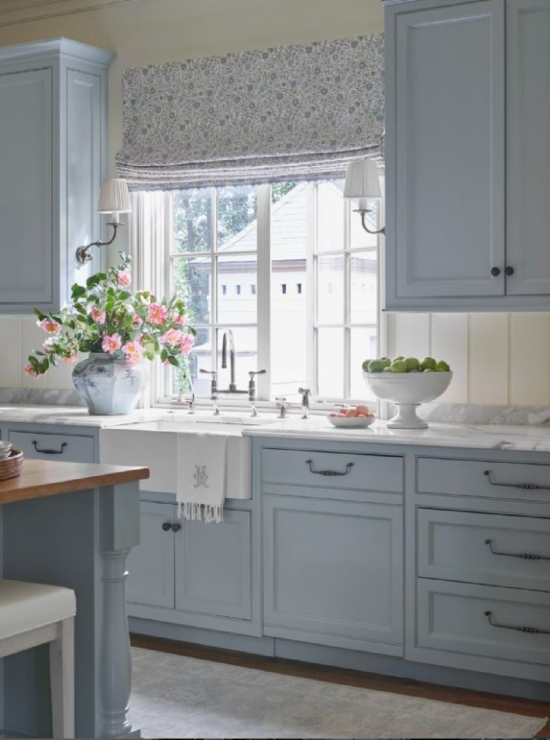 Farrow & Ball Light Blue kitchen cabinets in a traditional style kitchen by @laurendeloachinteriors. #farrowandballlightblue #bluekitchencabinets