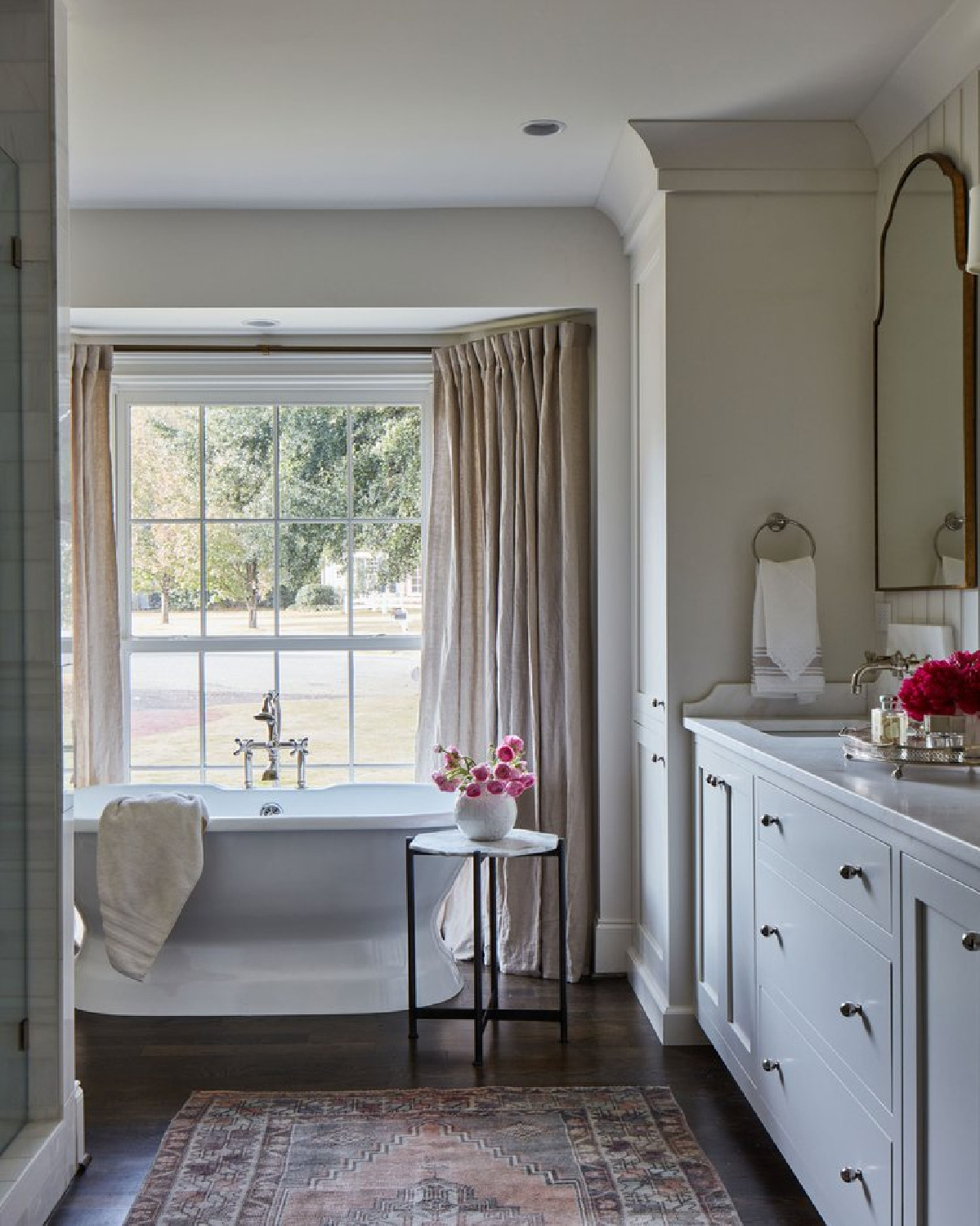 Lovely double vanity with antique gold ornate mirrors in a timeless bath by @riverbrook_. #timelessbath #oldworldstyle