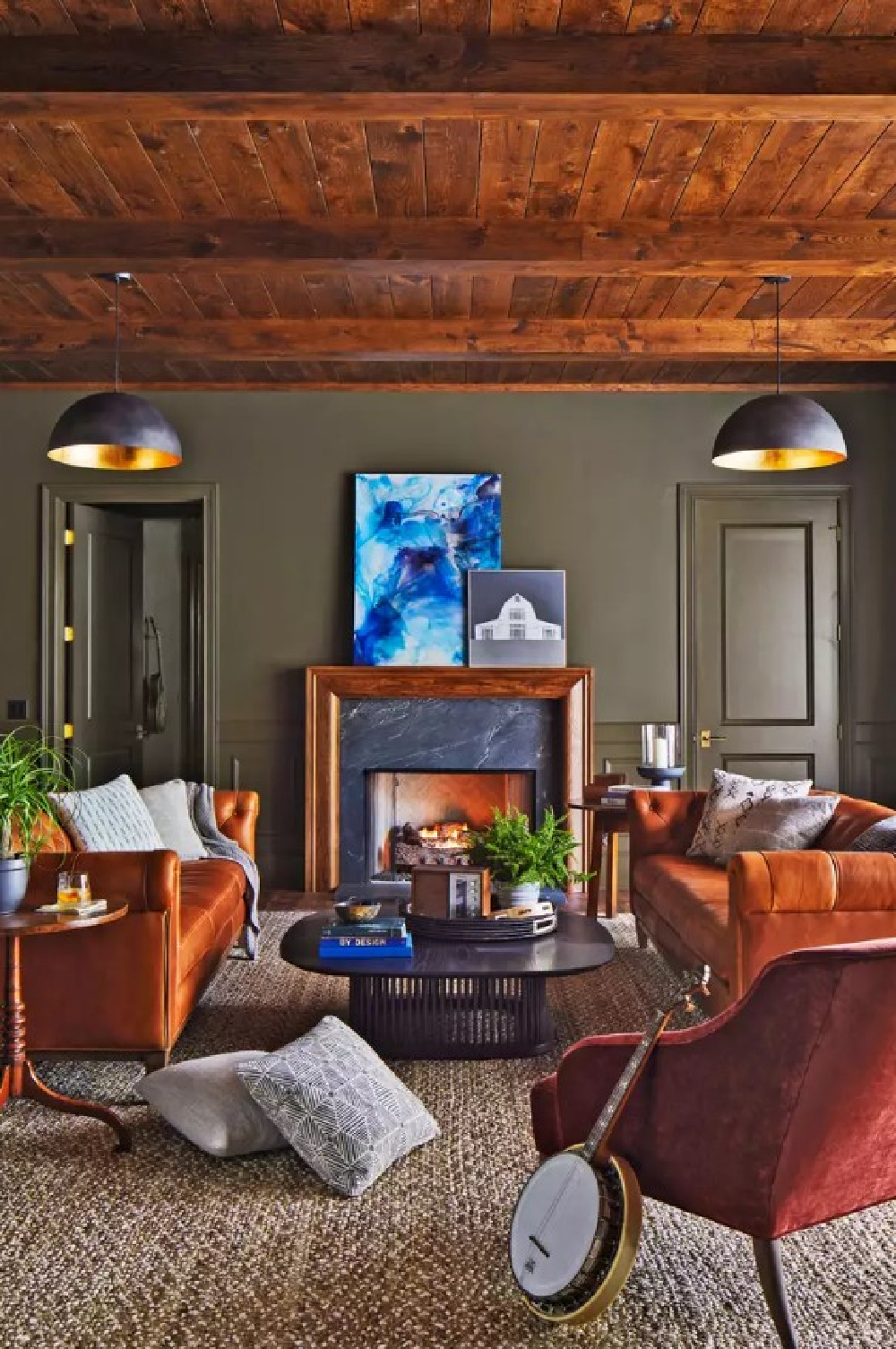 Sherwin Williams NOCTURNE in a basement lounge by Laura Hodges Studio for Southern Living Idea House 2023. #sherwinwilliamsnocturne #moodypaintcolors