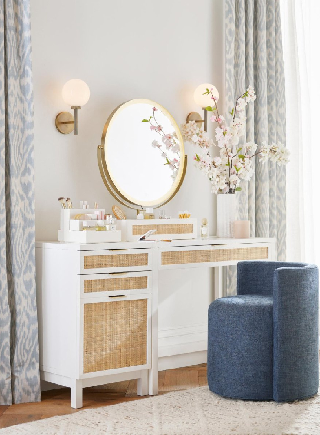 Makeup vanity with blue chair and blue patterned curtain panels, Pottery Barn.