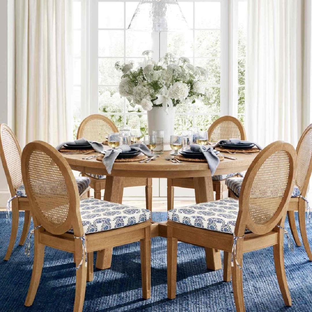 Dining room with blue rug, oval backed chairs, and blue accents, Pottery Barn.