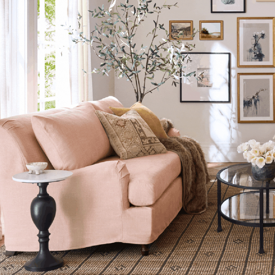Rose toned sofa in living room, Pottery Barn.