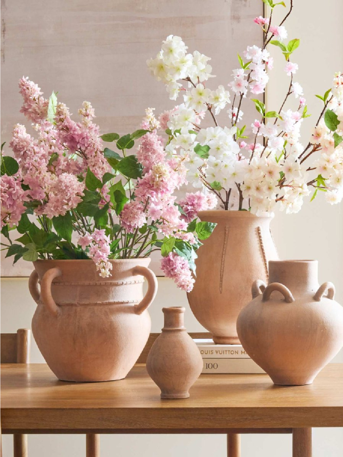Terracotta vases and urns with pink spring flowers, Pottery Barn.