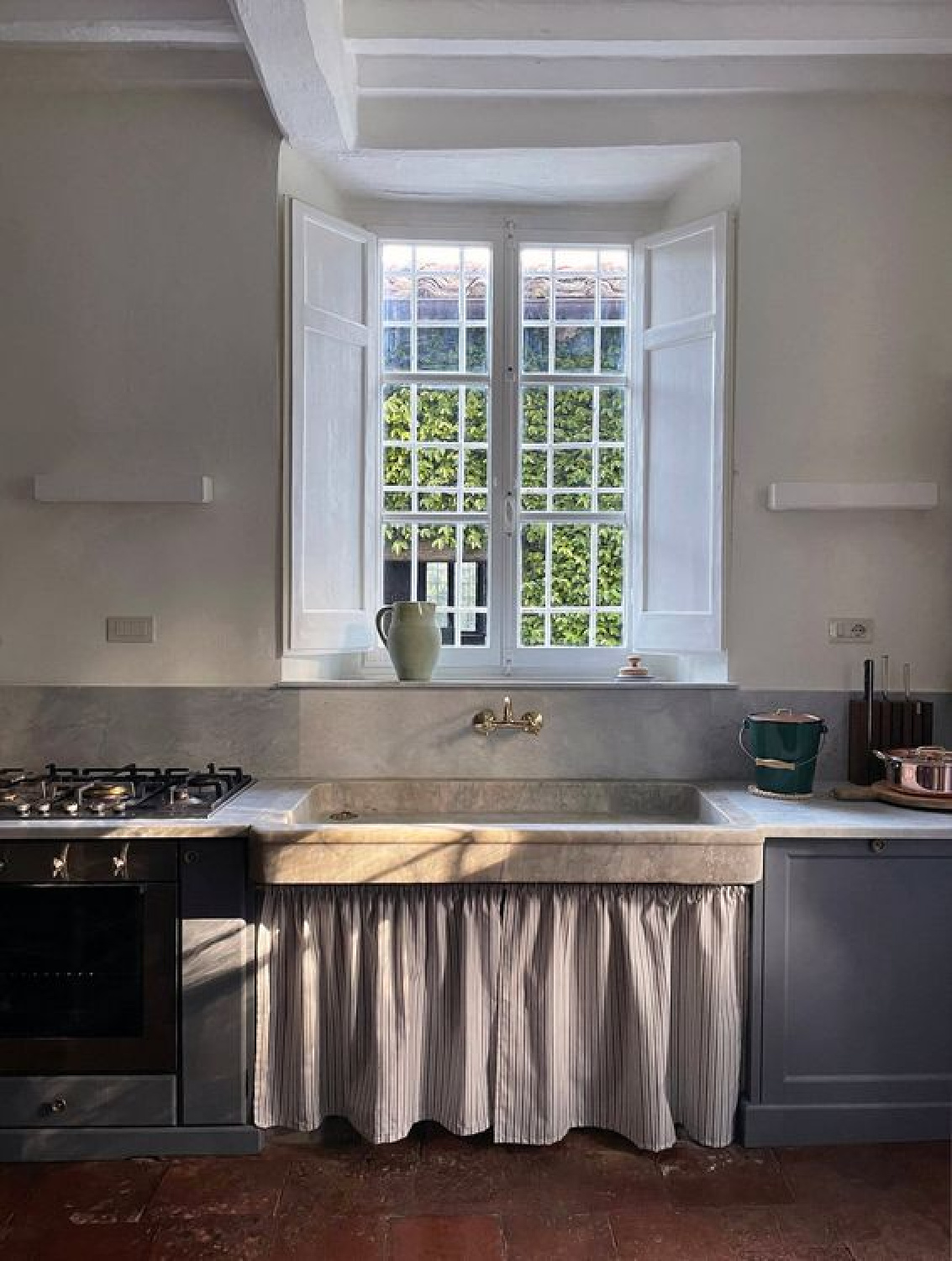 Italian villa kitchen with skirted stone sink - NY Times.