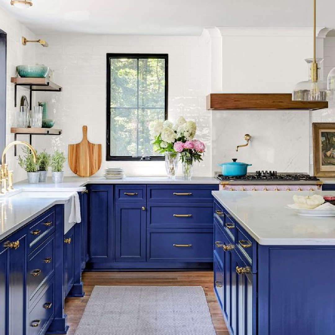 Sherwin Williams Naval painted blue cabinets in a country kitchen by Stephen Shutts. #swnaval