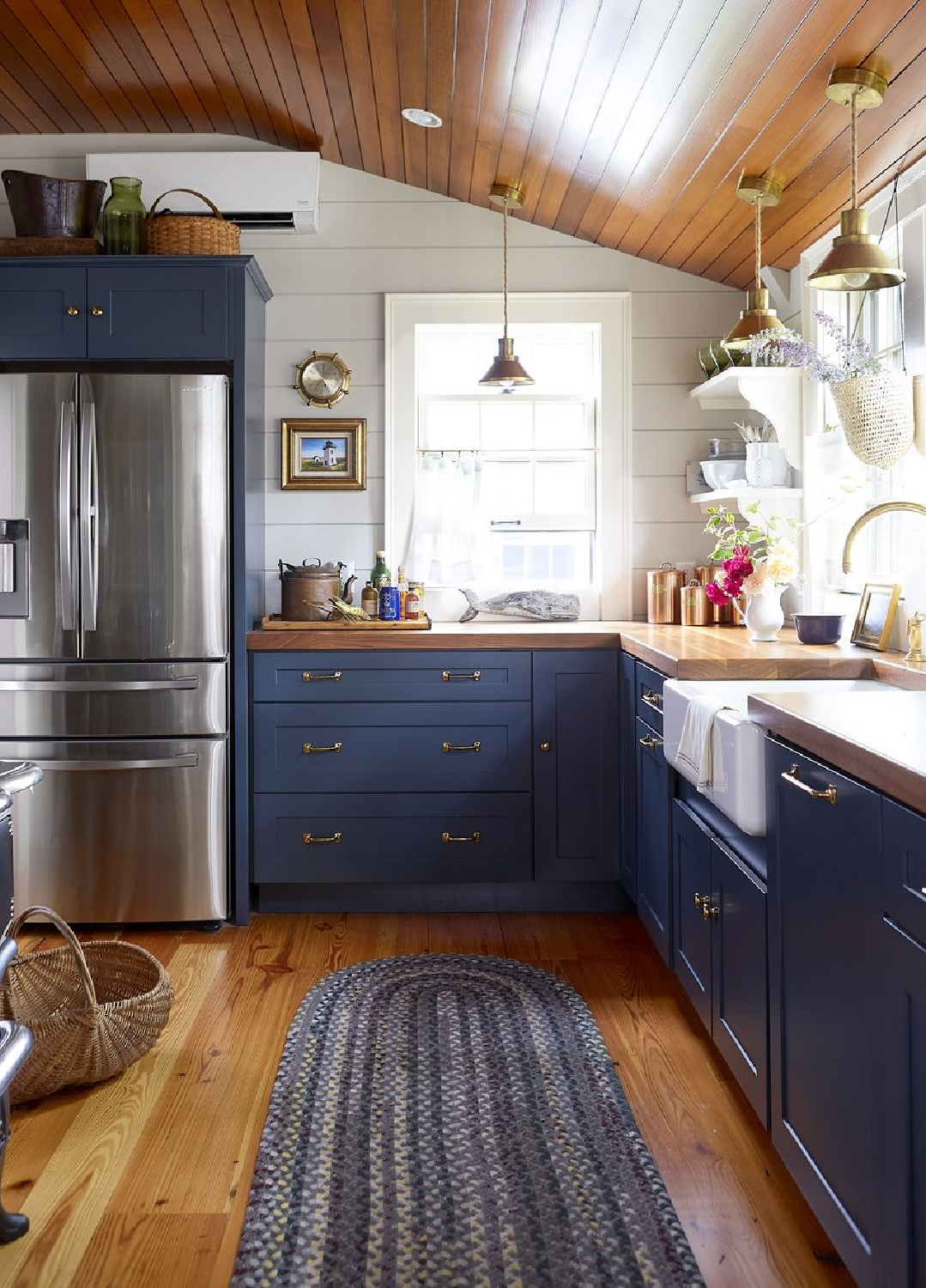 Sherwin Williams SALTY DOG blue kitchen cabinets in Country Living. 