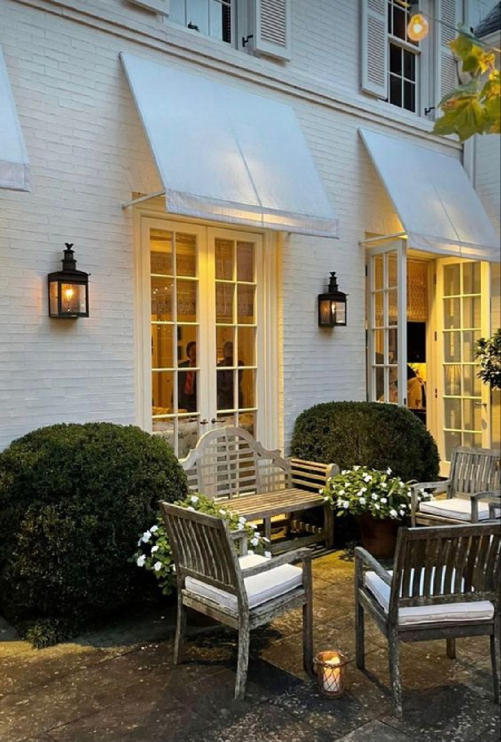 Beautiful traditional white Southern home with awnings (Caroline Gidiere Design and architect James Carter). #carolinegidiere #whitefacades