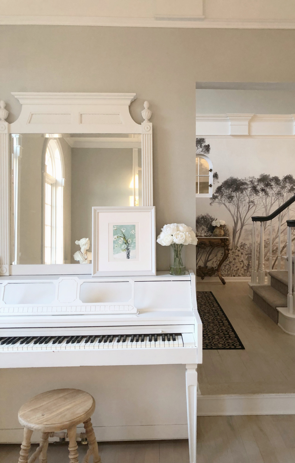 Serene music room with white piano, Holly Irwin painting, and SW Repose Gray walls - Hello Lovely. #reposegray #hollyirwin