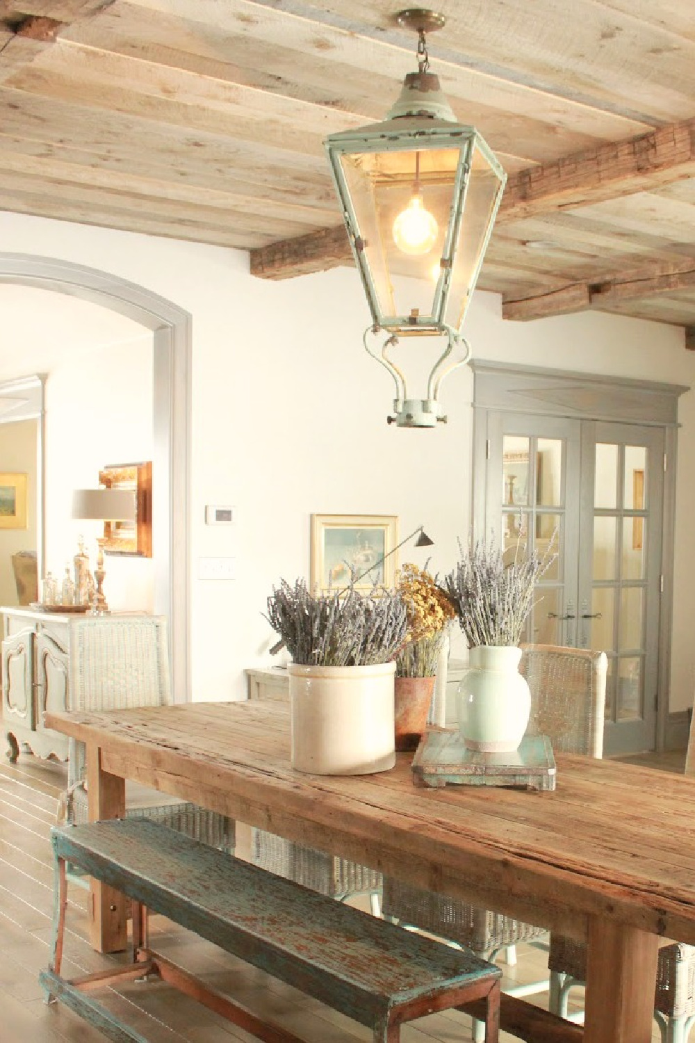 French country farmhouse dining room by Desiree Ashworth (Beljar Home) with rustic wood ceiling and light grey custom stained trim. #beljarhome #frenchdiningroom