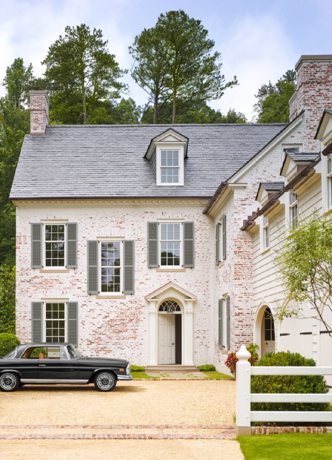 Benjamin Moore Glacier White on siding of Georgian house by James Carter in Veranda (photo by Annie Schlechter).