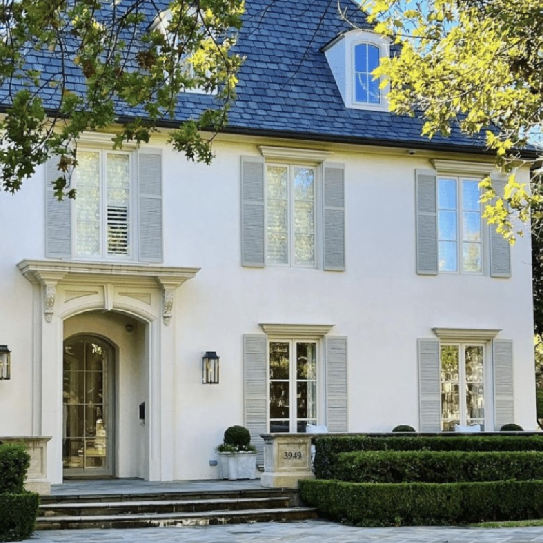 Lovely white house facade with shutters - The Potted Boxwood.