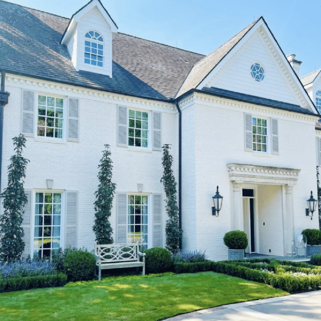 Lovely white house facade with shutters - The Potted Boxwood.