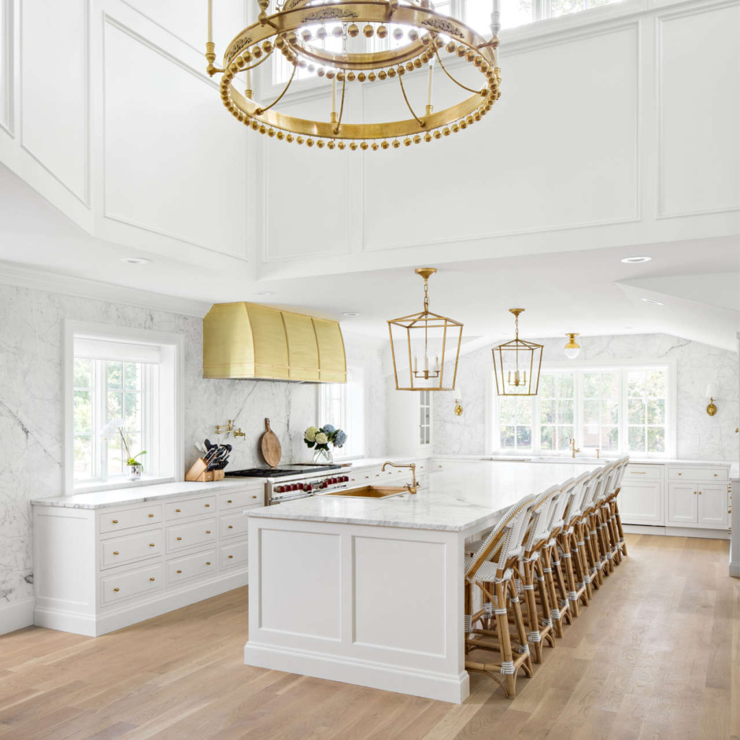 Simply White (Benjamin Moore) grand white kitchen with elegant finishes - The Fox Group. #elegantkitchens #benjaminmooresimplywhite