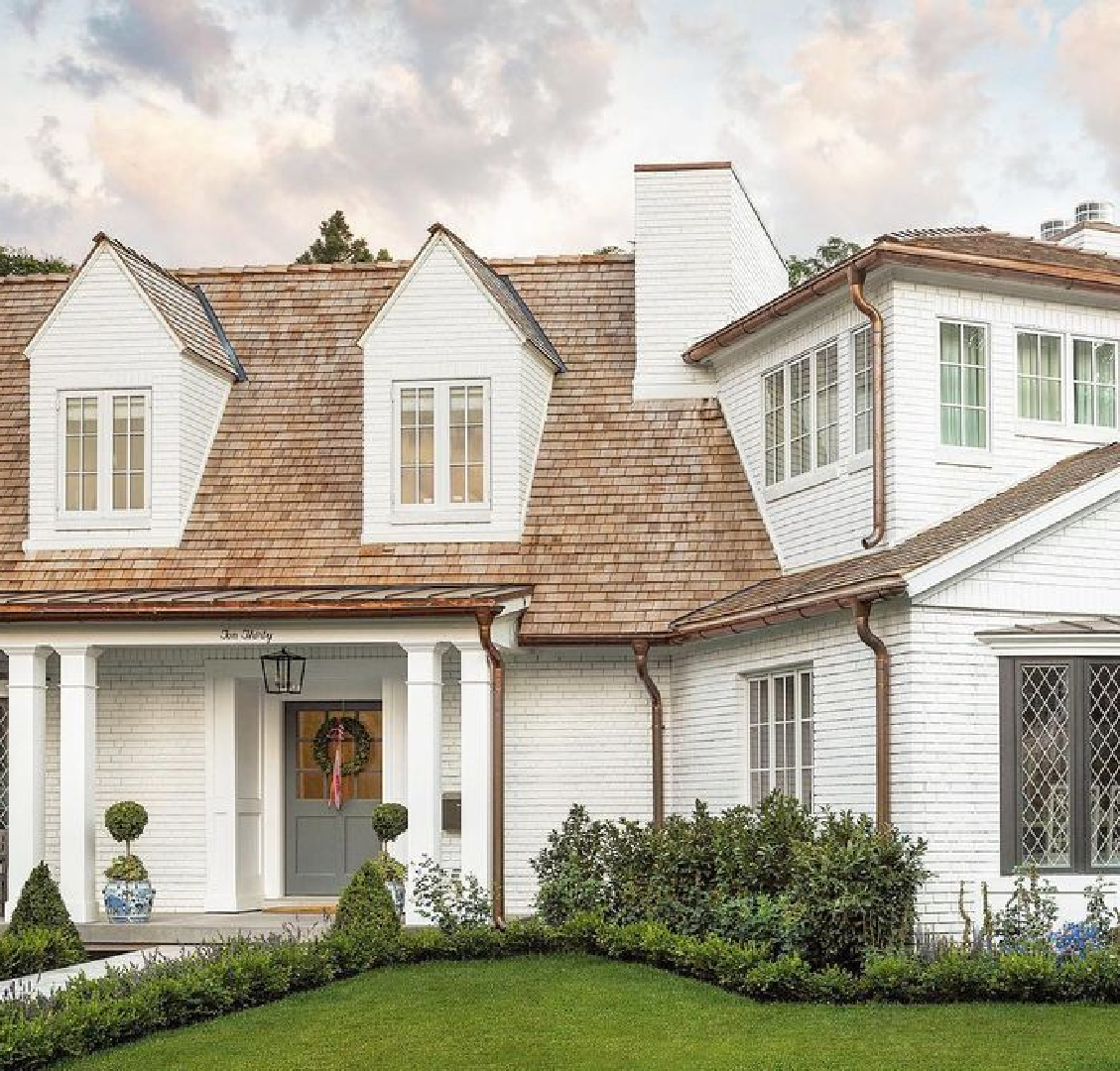 Benjamin Moore Simply White brick Tudor style home renovation by The Fox Group. #benjaminmooresimplywhite #tudorstyle